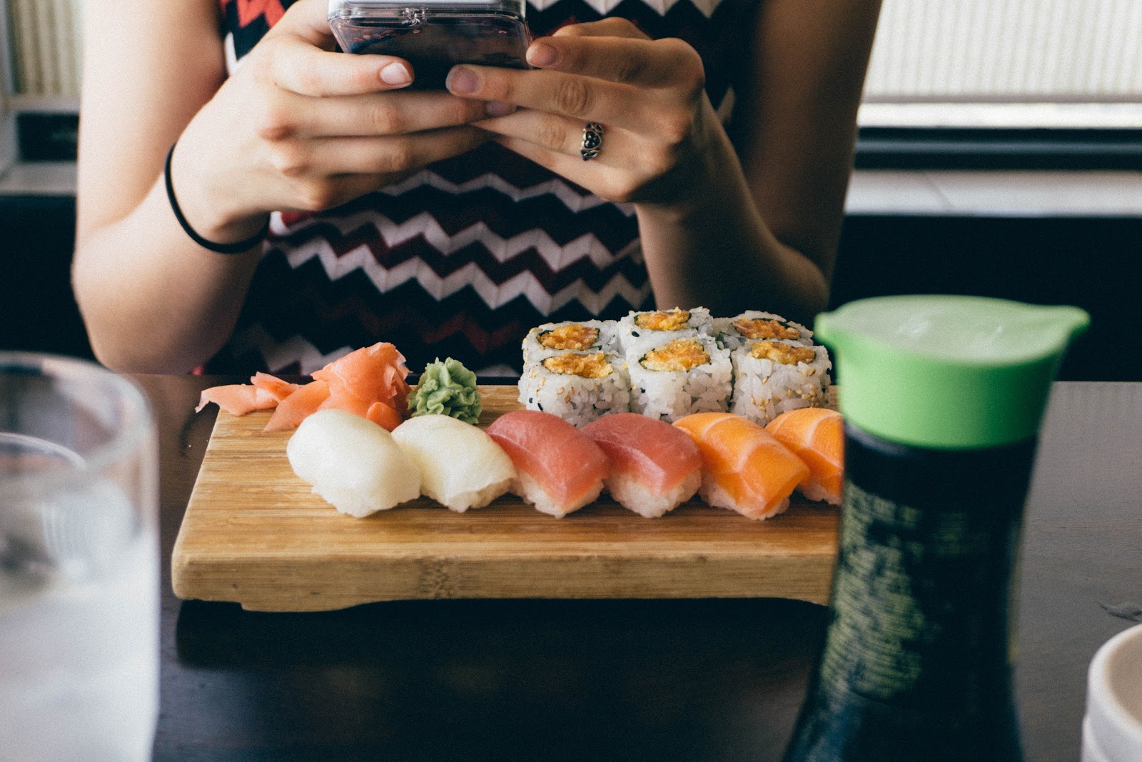 Restaurant customer eating sushi